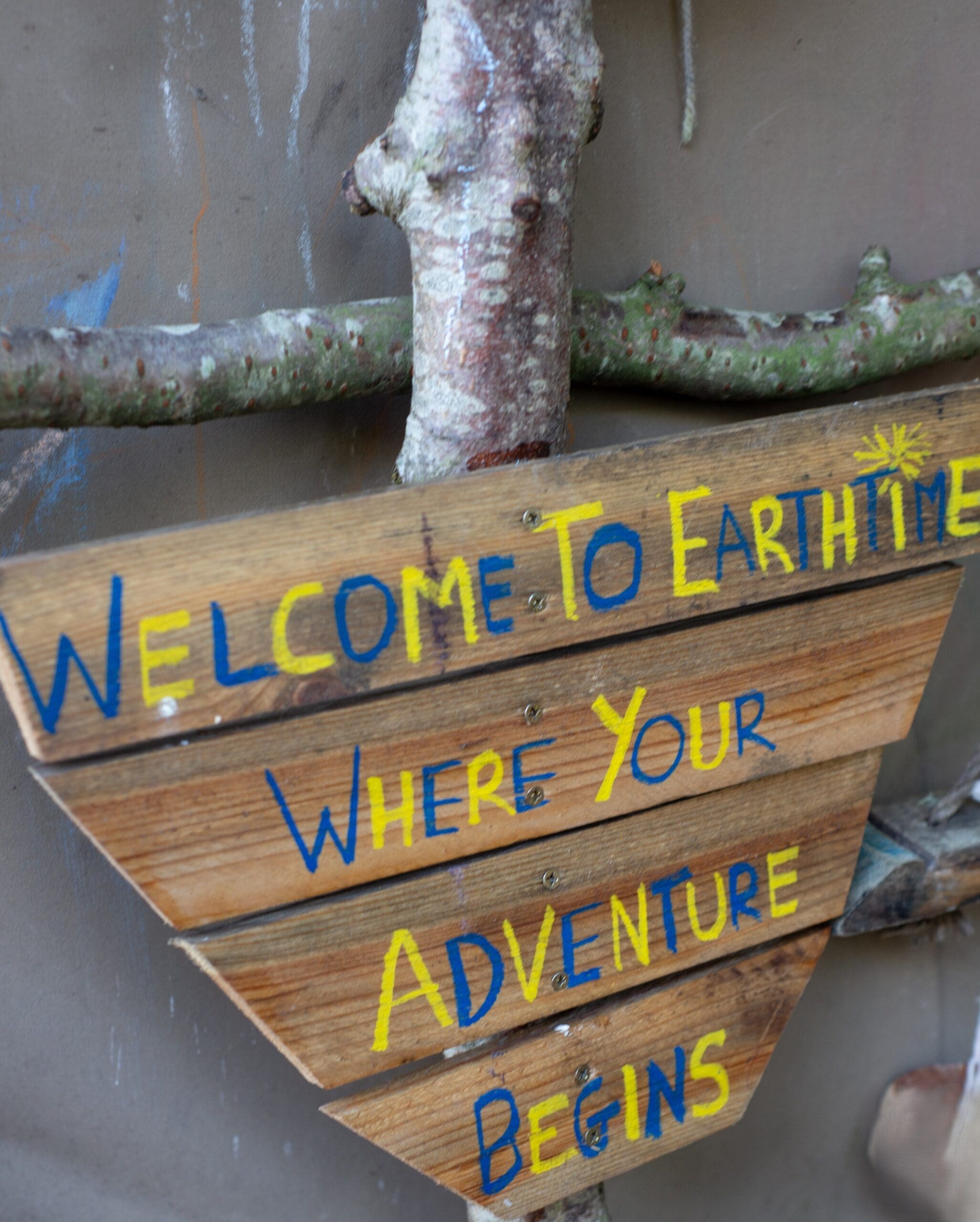 CEA_7856edit Wooden sign which reads Welcome to Earthtime where your adventure awaits.